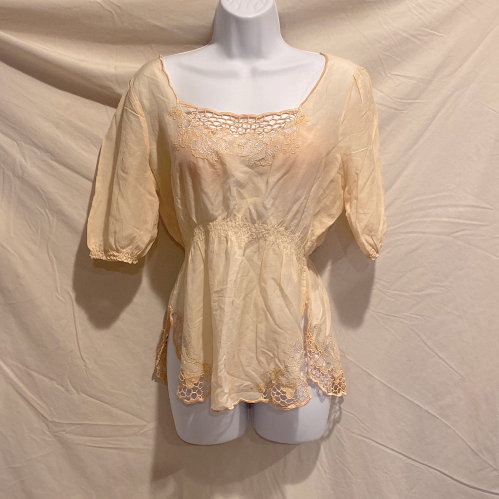 Adorable shirt with beautiful embroidery and scallop bottom